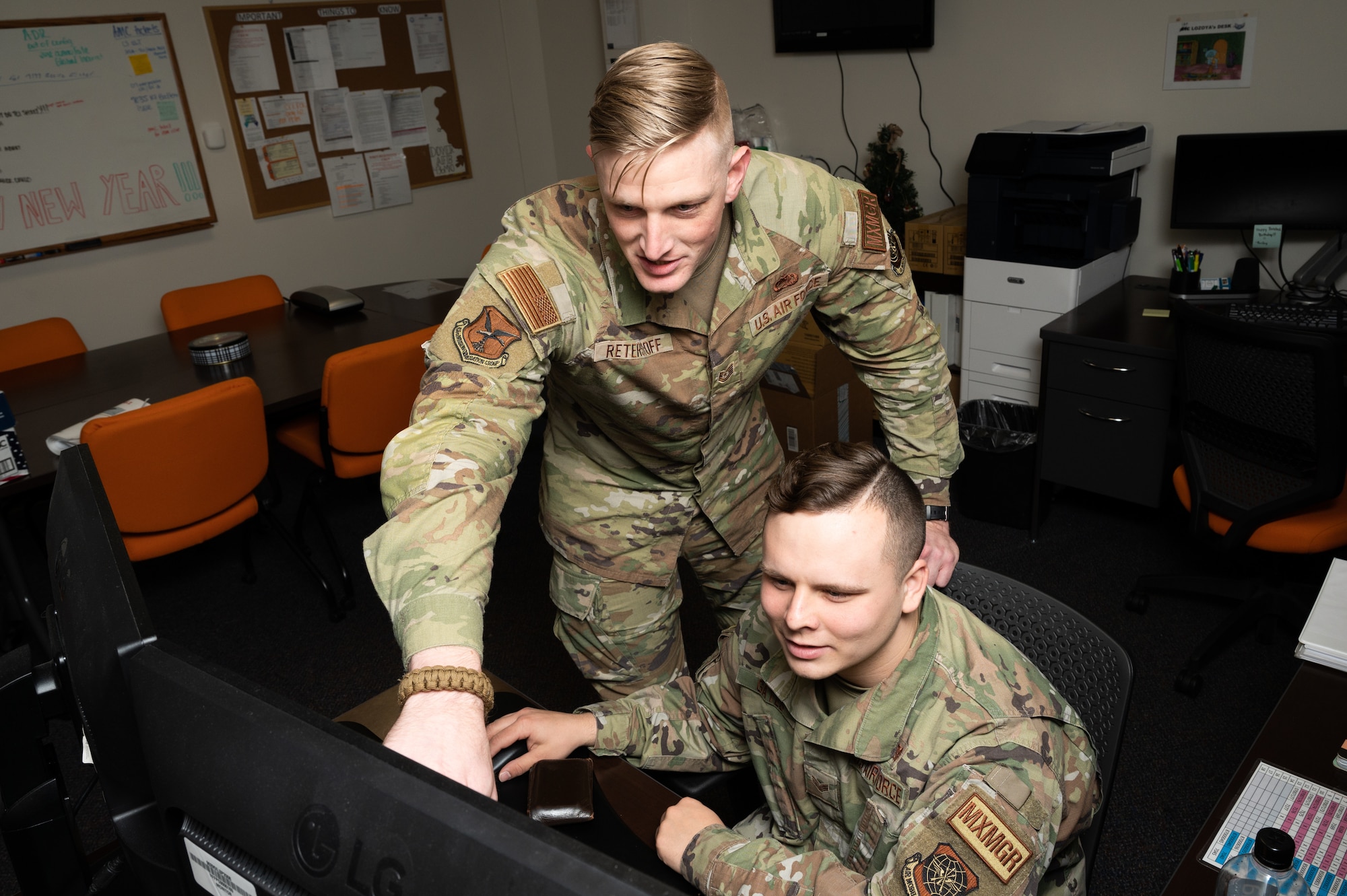 Tech. Sgt. Ethan Reterstoff, 436th Maintenance Group noncommissioned officer in charge of scheduling and Senior Airman Regan Gates, 436th Maintenance Group maintenance management production journeyman, review remarks on a maintenance order at Dover Air Force Base, Delaware, Jan. 11, 2023. The Plans and Scheduling section builds and compiles the flying and maintenance schedules for the 9th Airlift Squadron and 3rd AS. (U.S. Air Force photo by Mauricio Campino)