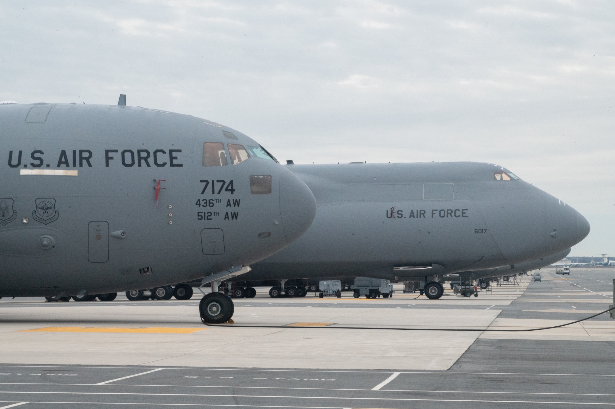 A C-17 Globemaster III and a C-5M Super Galaxy sit on the flightline at Dover Air Force Base, Delaware, Jan. 30, 2023. The Plans and Scheduling team oversees a total of 18 C-5M Super Galaxies and 13 C-17s at Dover AFB. (U.S. Air Force photo by Mauricio Campino)