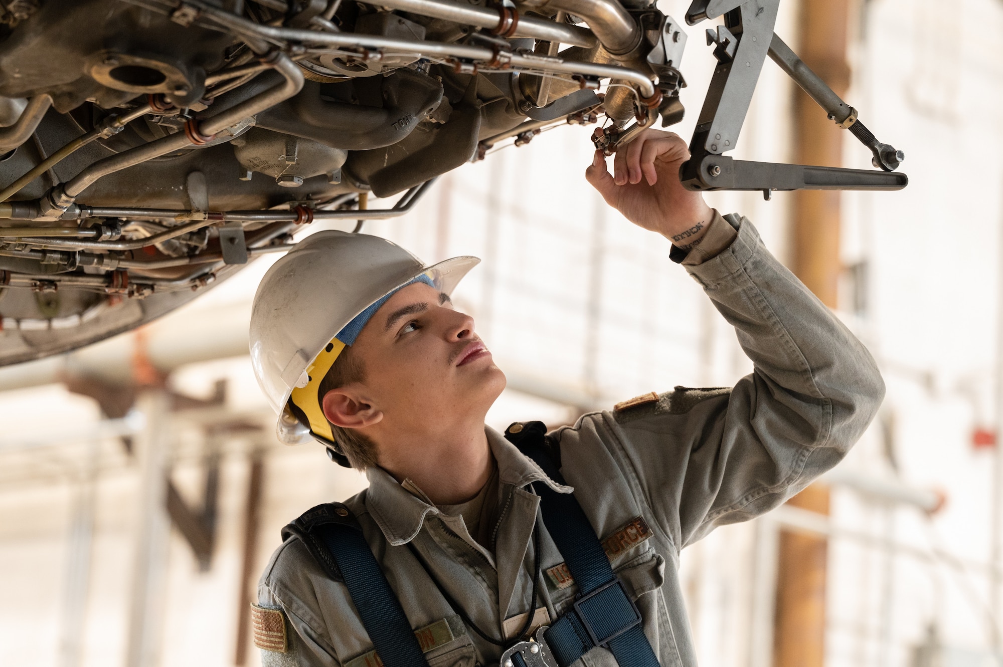 Senior Airman Christopher Longsdon, 736th Aircraft Maintenance Squadron C-17 Globemaster III crew chief inspects fire loops on an engine at Dover Air Force Base, Delaware, Jan. 24, 2023. The Plans and Scheduling team oversees a total of 18 C-5M Super Galaxies and 13 C-17s  at Dover AFB. (U.S. Air Force photo by Mauricio Campino)