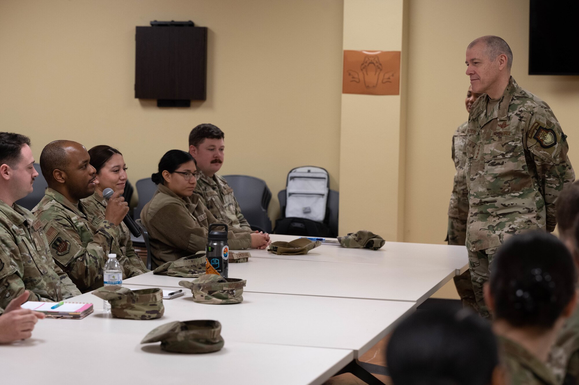 U.S. Air Force Gen. Thomas Bussiere, Air Force Global Strike Command (AFGSC) commander, listens to question from 2nd Bomb Wing Airmen during a panel at Barksdale Air Force Base, La., Jan. 27, 2023.