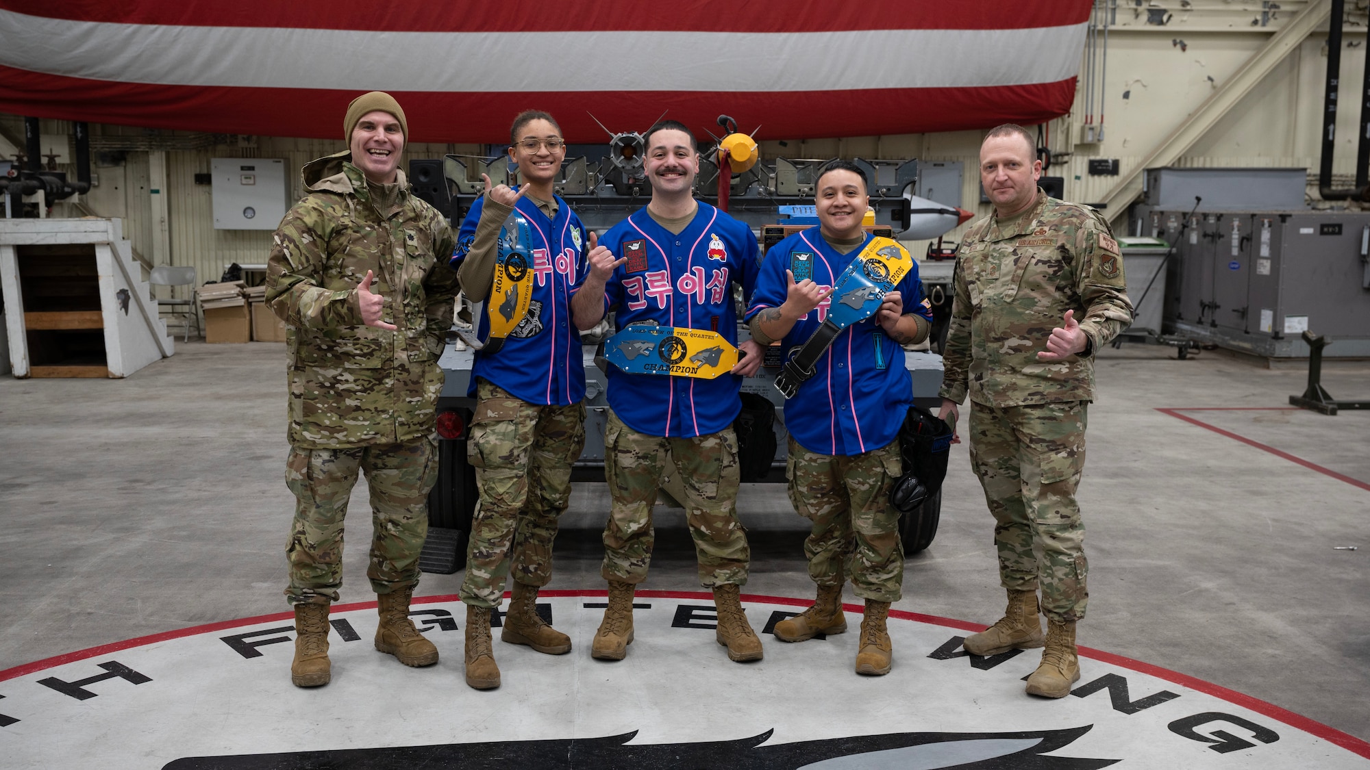 A group of Load Crew Airmen wins the 4th Quarter Load Crew Competition and pose for a photo with Wing leadership.