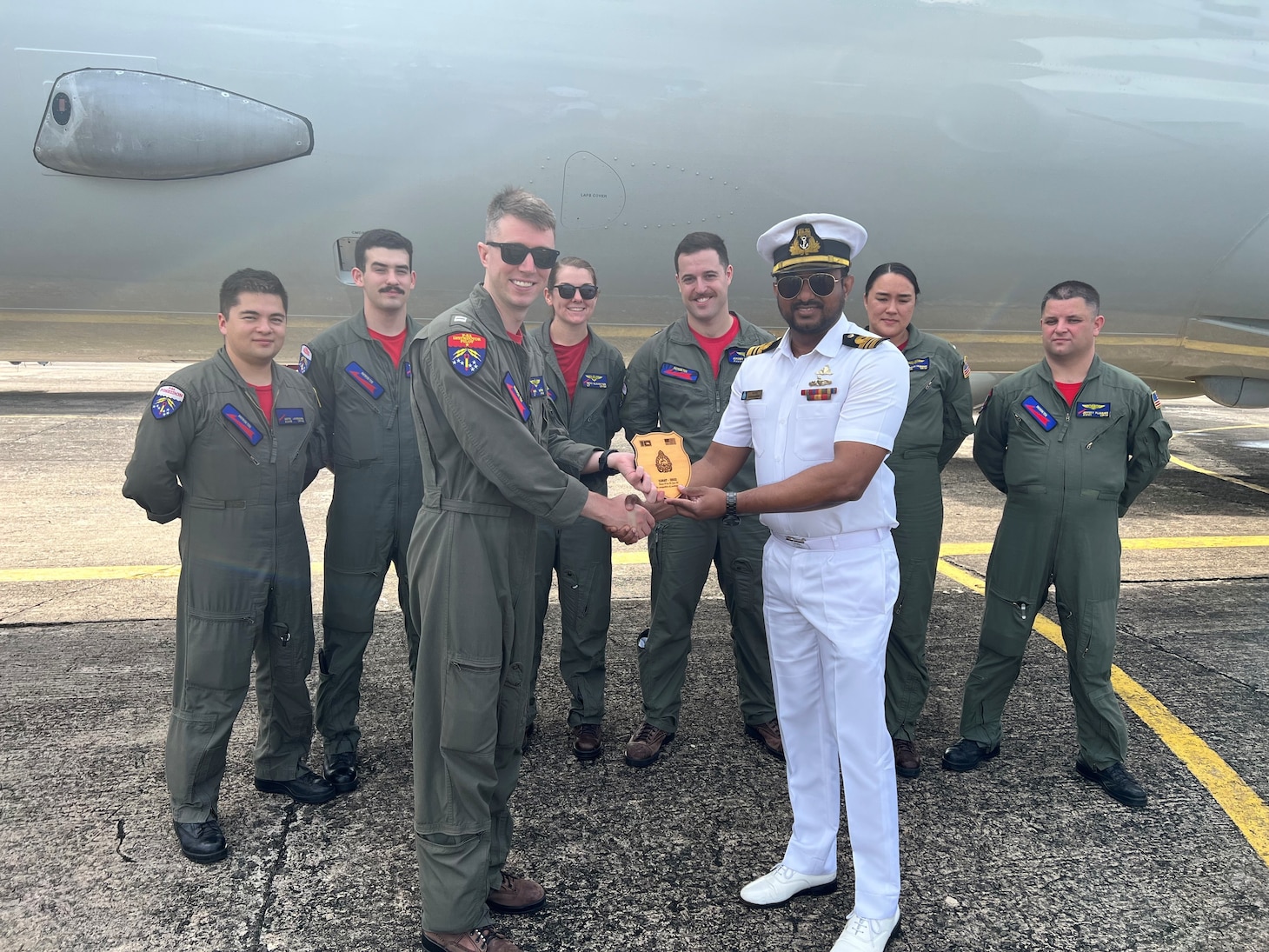 (230124-N-FY142-0002) COLOMBO, Sri Lanka (Jan. 24, 2023) – Lt. Cmdr. Harischandra of the Sri Lanka Navy presents Lt. Nick Morris of Patrol Squadron (VP) 10 and Combat Aircrew 5 with a plaque as a token of appreciation for their involvement in exercise Cooperation Afloat Readiness and Training/Marine Exercise Sri Lanka 2022. VP-10 is currently operating from Kadena Air Base in Okinawa, Japan. The squadron conducts maritime patrol and reconnaissance, as well as theater outreach operations, as part of a rotational deployment to the U.S. 7th Fleet area of operations. (U.S. Navy photo by Lt. j.g. Brian DePaola)