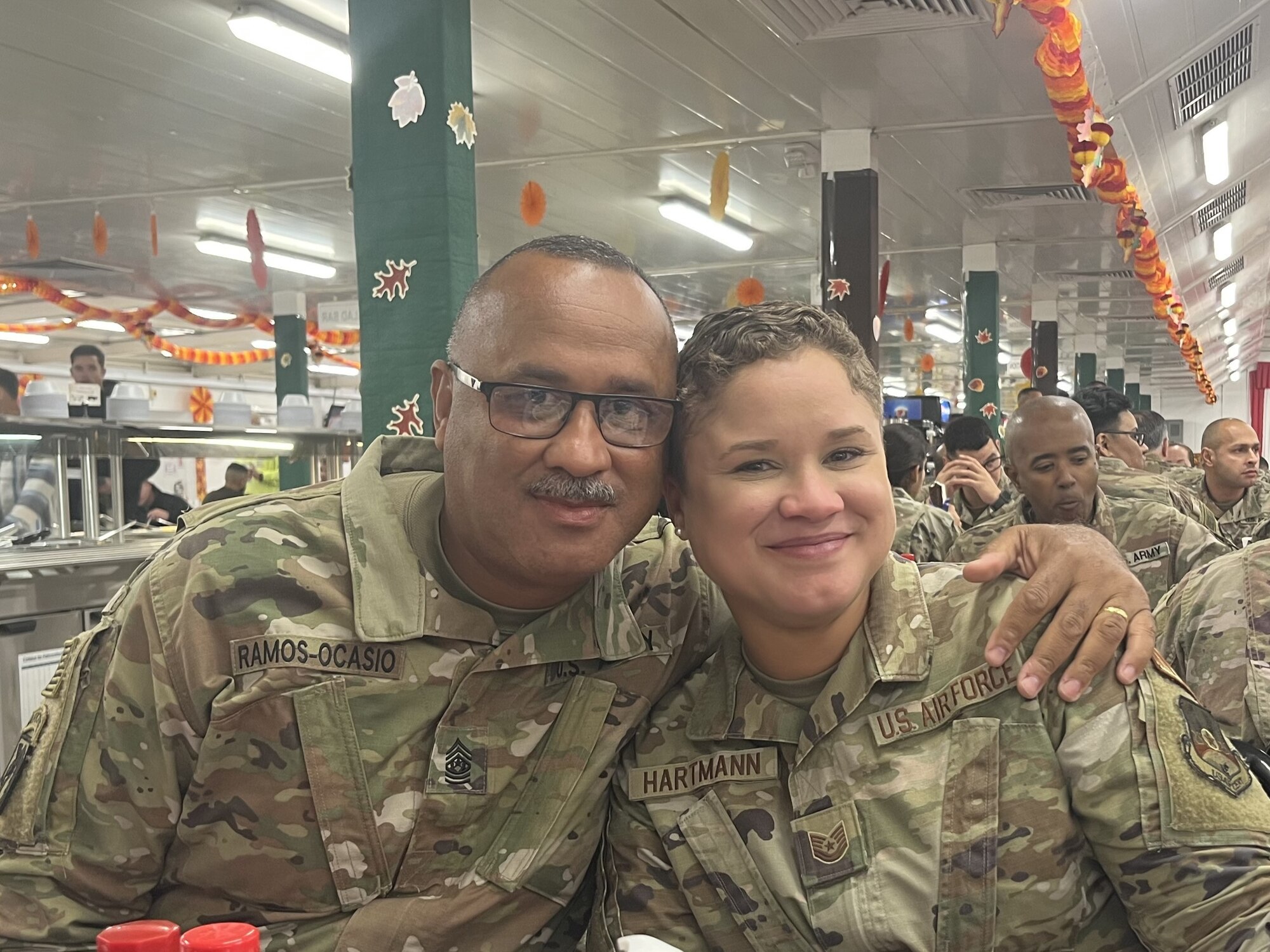U.S. Air Force Tech. Sgt. Leilany Hartmann is surprised by her father, CSM Jose Antonio Ramos-Ocasio, 191st Regional Support Group of the Puerto Rico National Guard, while deployed to Ali Al Salem Air Base, Kuwait.