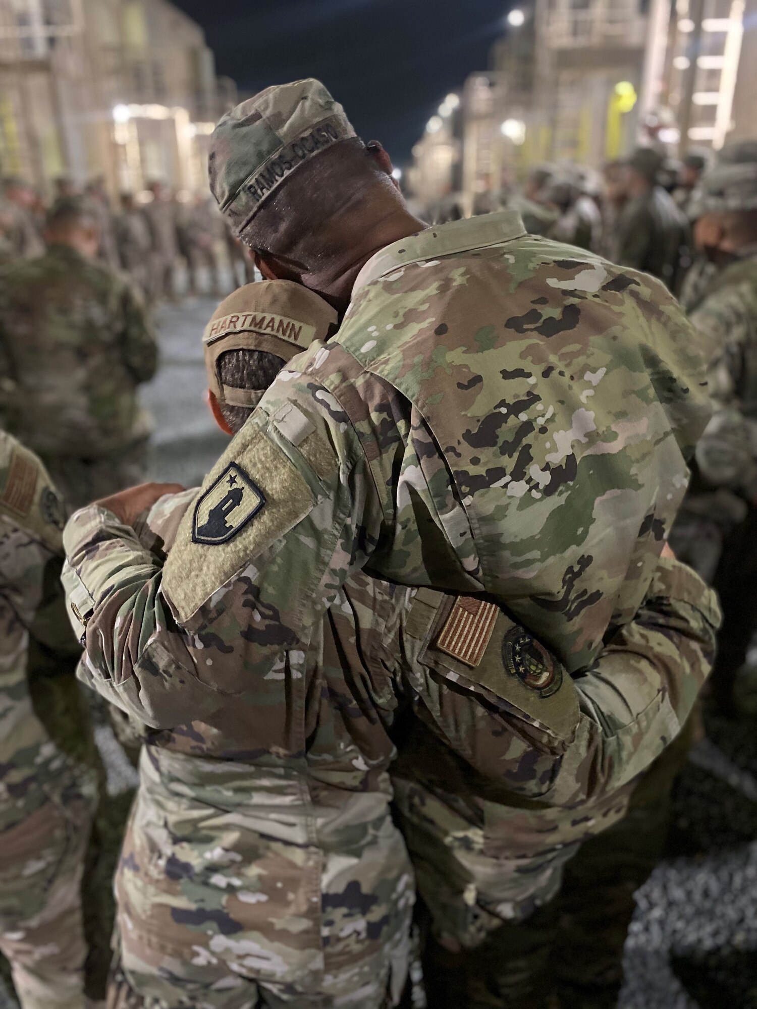 U.S. Air Force Tech. Sgt. Leilany Hartmann is surprised by her father, CSM Jose Antonio Ramos-Ocasio, 191st Regional Support Group of the Puerto Rico National Guard, while deployed to Ali Al Salem Air Base, Kuwait.