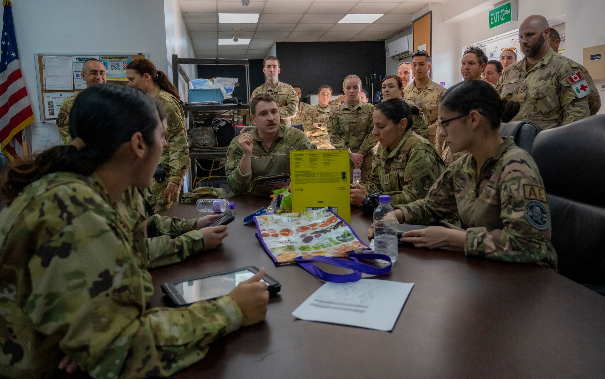 U.S. Air Force Airmen and coalition partners are briefed on a simulated event before medical evacuation training at Ali Al Salem Air Base, Kuwait, Jan. 20, 2023.
