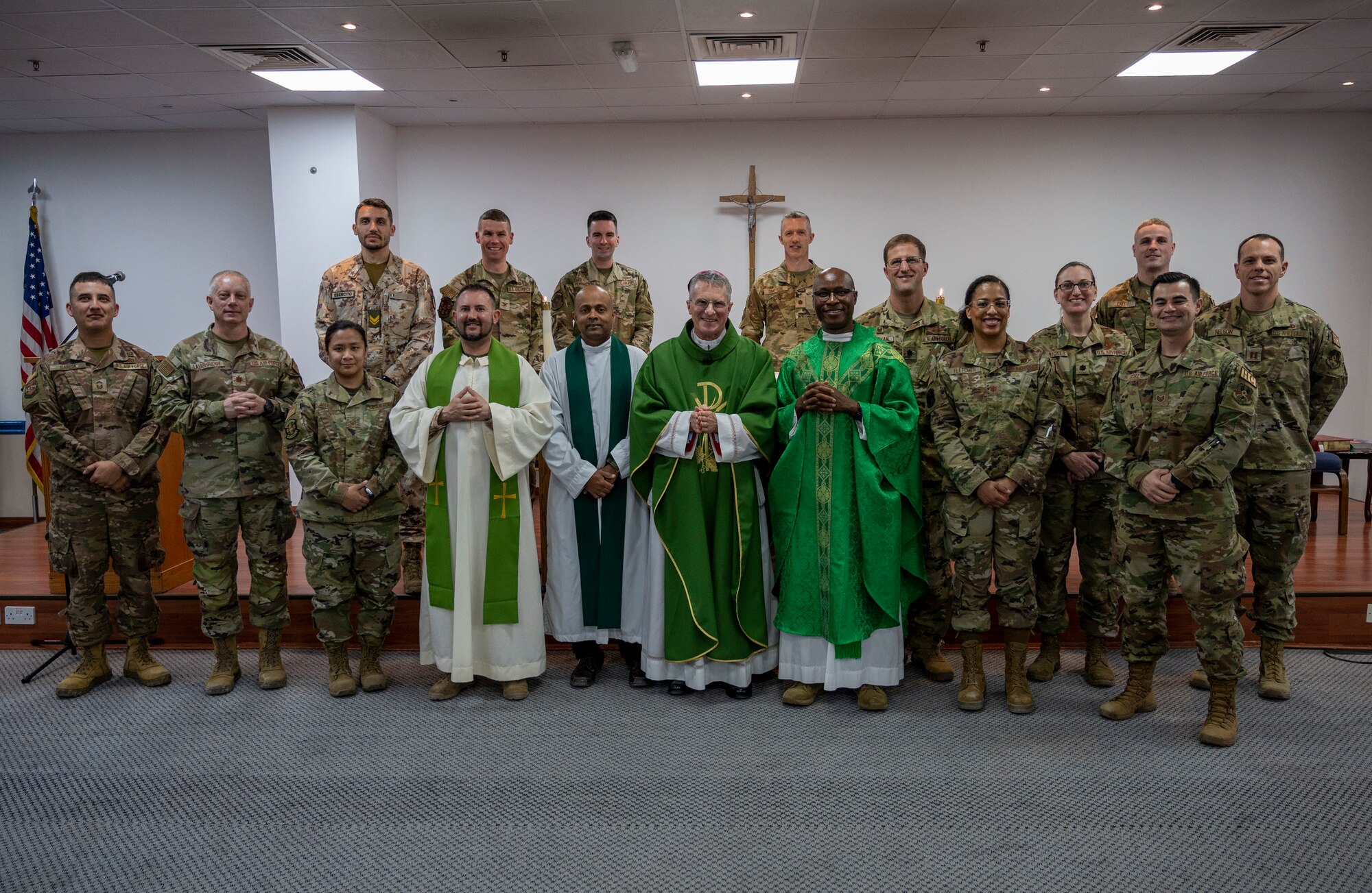 Archbishop Timothy Broglio, Archdiocese Military Services, is joined at the altar with Airmen who attended Mass at Ali Al Salem Air Base, Kuwait, Jan. 30, 2023.