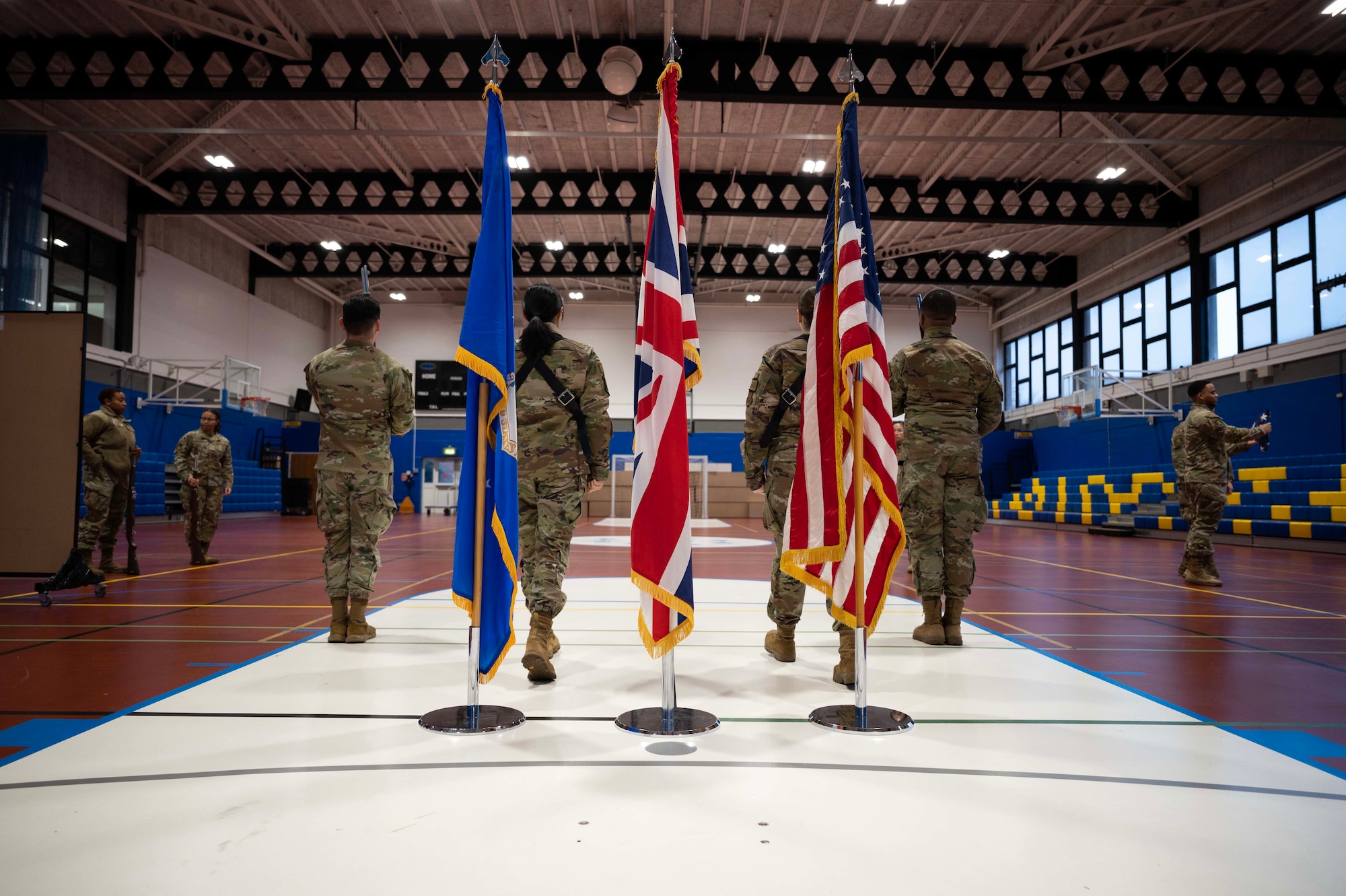 The Team Mildenhall honor guard poses for a group photo after practice at Royal Air Force Mildenhall, England, Jan. 26, 2023. The base honor guard emphasizes the importance of military customs and courtesies, dress and appearance, and drill and ceremony. (U.S. Air Force photo by Airman 1st Class Viviam Chiu)