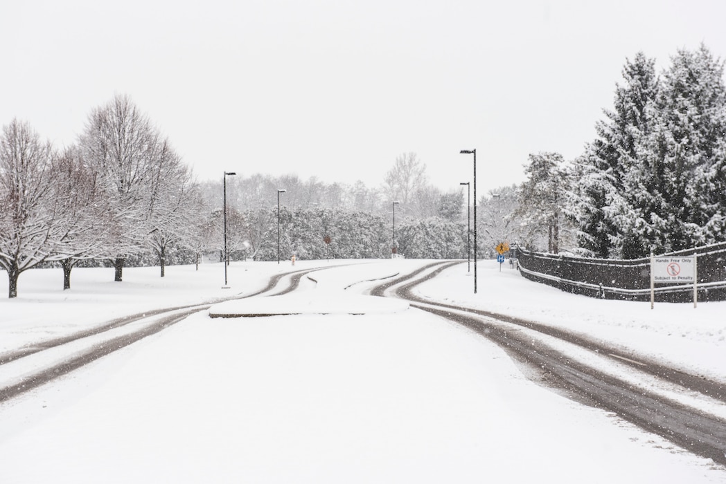 Tire tracks are outlined along a snowy road in Area A on Jan. 22 at Wright-Patterson Air Force Base, Ohio.
