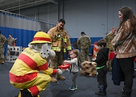 Team Minot families and their children rallied at the Community Complex Center for Operation Hero at Minot Air Force Base, North Dakota, Jan. 20, 2023. Airmen assigned to 20 different agencies from the 5th Bomb Wing and the 91st Missile Wing showcased their duties, conducted demonstrations, and provided interactive experiences to over 150 families. (U.S. Air Force photo by Senior Airman Caleb S. Kimmell)