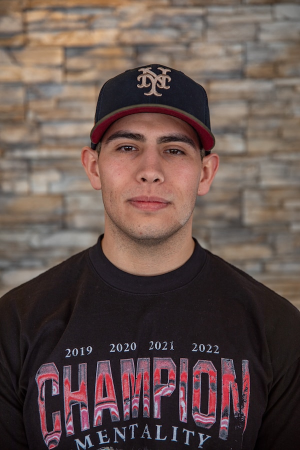 Cpl. Robert Alara, an ammo technician previously stationed in Marine Corps Base Camp Pendleton, California, poses for a portrait before continuing with the Individual Ready Reserve (IRR) Muster process, Manhattan Beach, California, Jan. 21, 2023. Marines that take part in the IRR Muster are screened in order to ensure readiness for augmentation into the active component of the total force. The IRR Marines were required to attend a reserve opportunity and obligations brief as well as complete an admin audit in order to ensure their information is up to date in the case of receiving recall orders. (U.S. Marine Corps photo by Cpl. Jonathan L. Gonzalez)