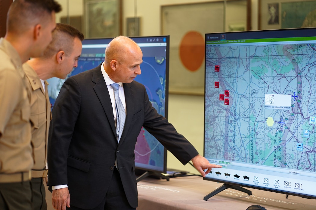 Timothy Barrick, Wargaming Director, Krulak Center for Innovation and Future Warfare, Marine Corps University, demonstrates wargames within the Wargaming Cloud at Warner Hall on Marine Corps Base Quantico, Virginia, September 23, 2022.