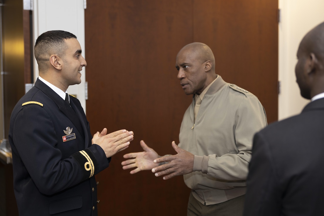 Gen. Michael Langley, right, commander, U.S. Africa Command, speaks with International Military Education and Training partners during a speaking engagement at MCB Quantico, Va., Dec. 12, 2022.