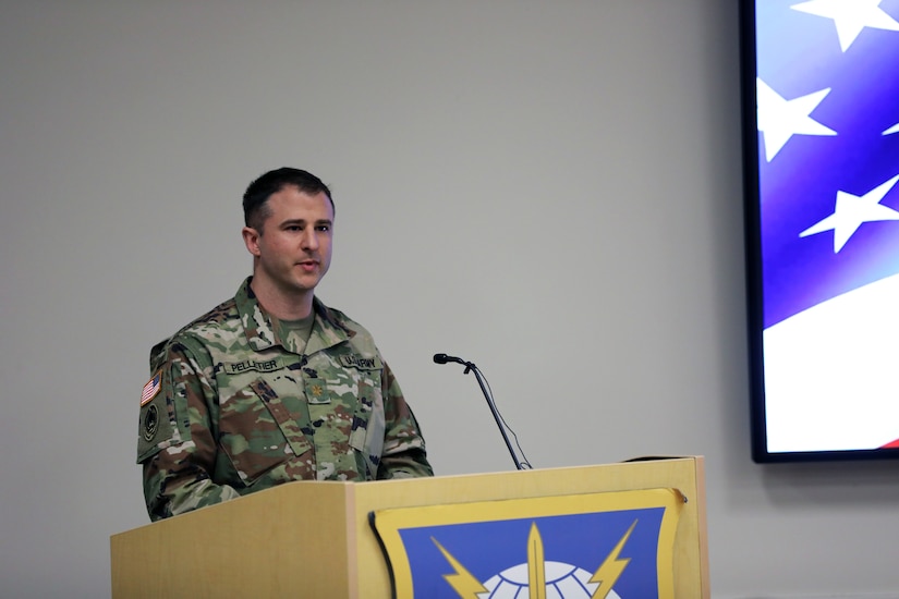 Soldier at a podium gives a speech.