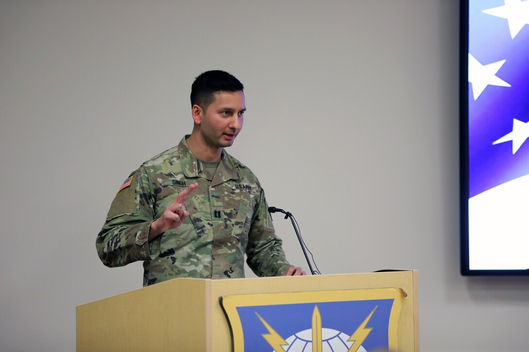 Soldier at a podium delivers a speech.