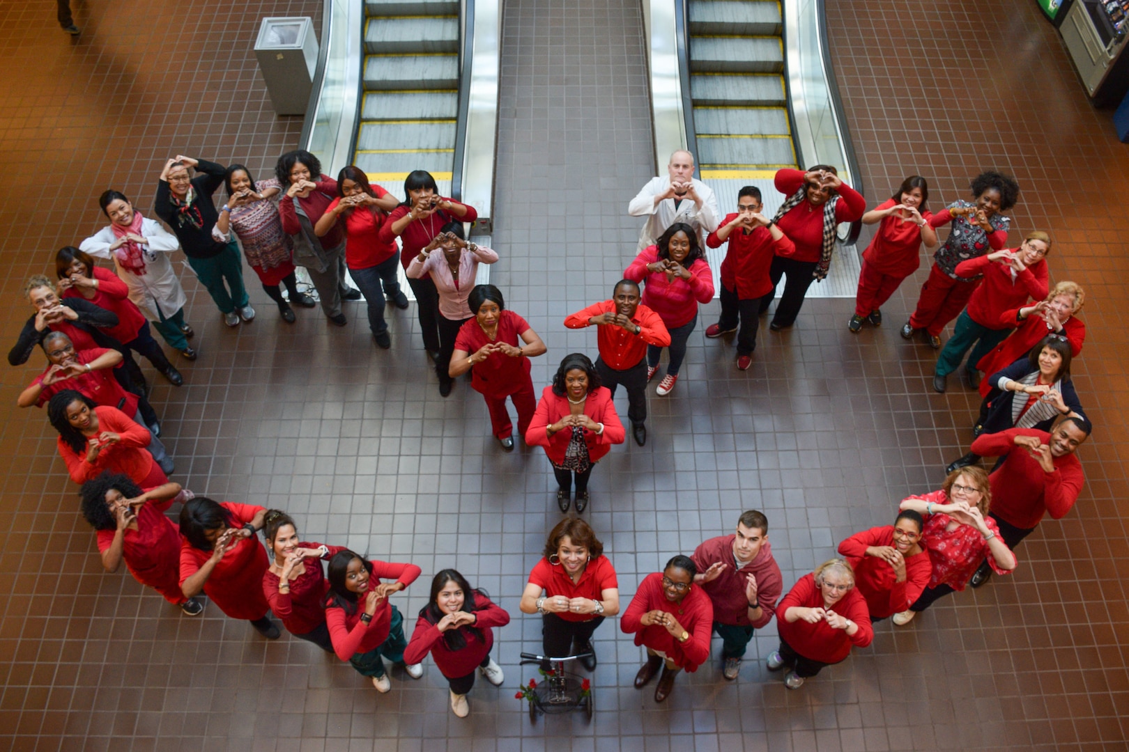 Staff of Cardiology at Walter Reed National Military Medical Center gather for a photograph in celebration of Wear Red Day in 2018 to raise awareness of heart health.