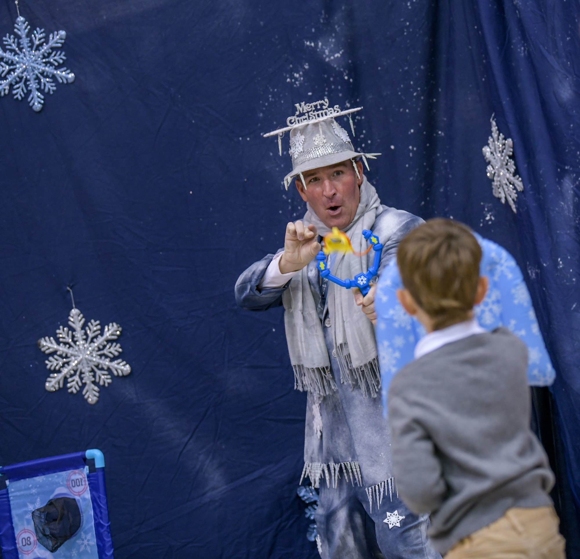 A Salvation Army Angel Tree Child takes part in the coloring station at Flight to the North Pole, an annual partnership between the 172nd Airlift Wing, Jackson, Mississippi, the Jackson, Mississippi Metro Area Salvation Army and the local community. U.S. Air National Guard photo by Staff Sgt. Jared Bounds.