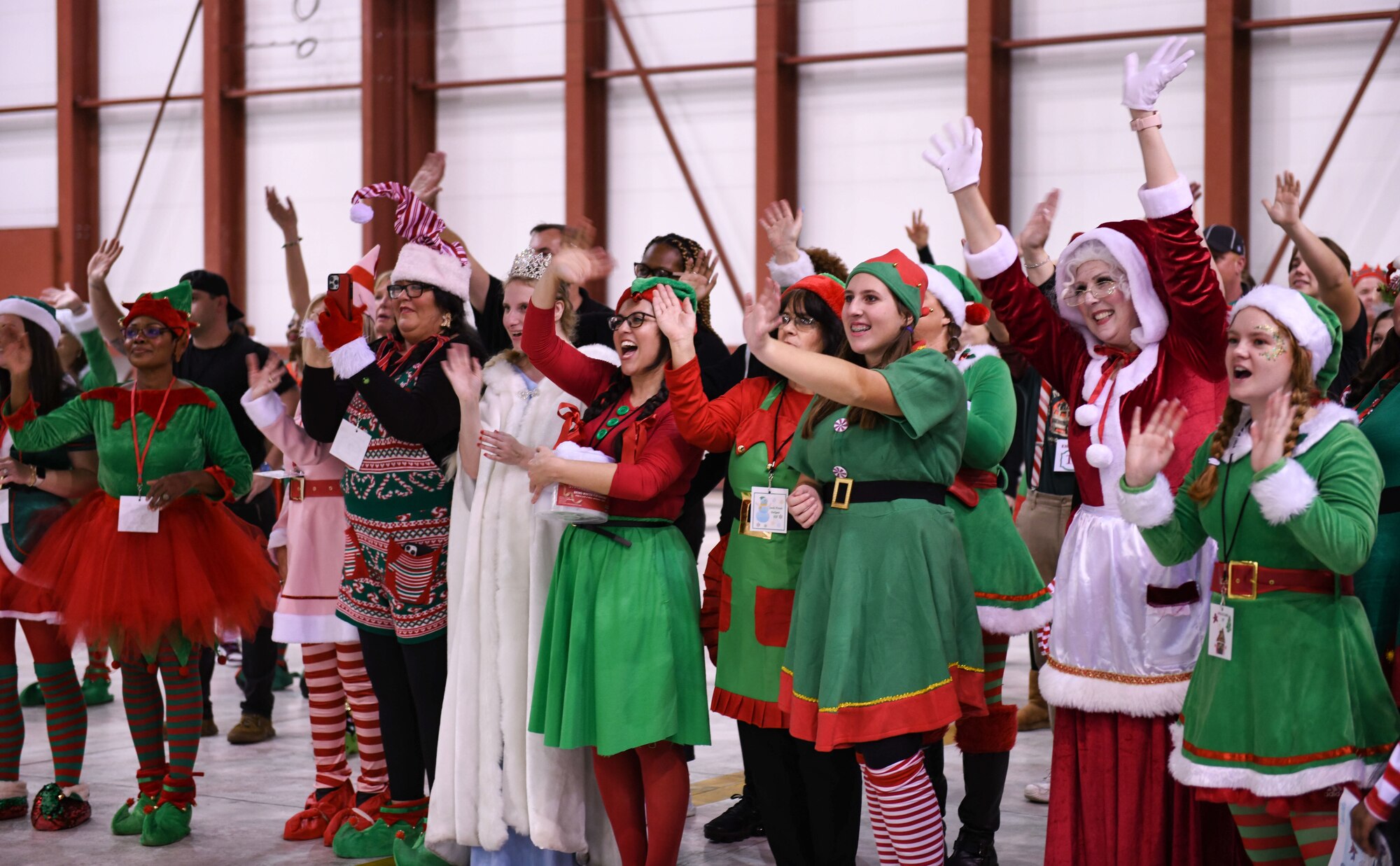 Local volunteers, or “Santa’s helpers”, wave goodbye as children embark on their flight back home from the North Pole at the 172nd Airlift Wing in Jackson, Mississippi, Dec. 13, 2022. Flight to the North Pole is an annual community outreach event benefiting the Salvation Army Angel Tree program, hosted by the 172nd Airlift Wing, Jackson Mississippi Metro Area Salvation Army and local volunteers. (U.S. Air National Guard photo by Airman 1st Class Shardae McAfee)