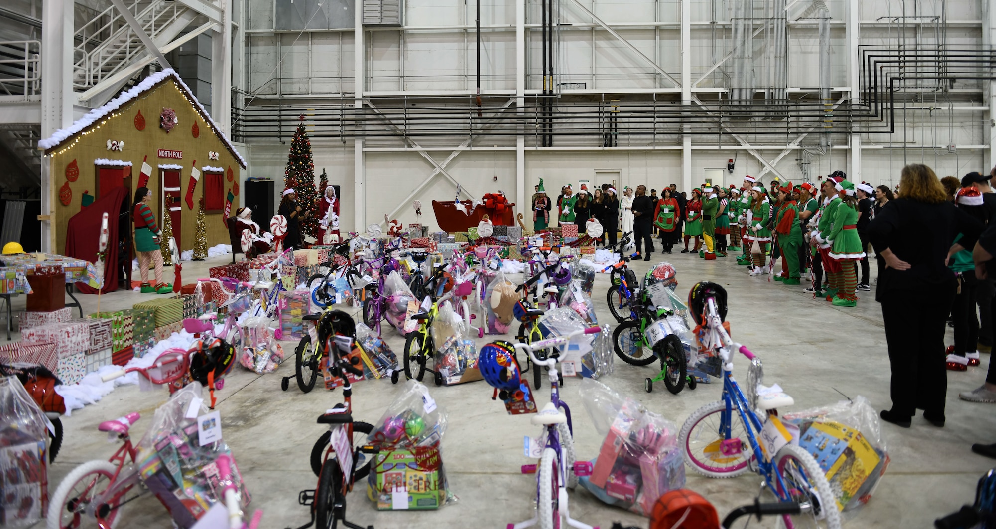 Volunteers prepare for “Santa’s Workshop” at the 172nd Airlift Wing in Jackson, Mississippi, Dec. 13, 2022. Flight to the North Pole is an annual community outreach event benefiting the Salvation Army Angel Tree program, hosted by the 172nd Airlift Wing, Jackson Mississippi Metro Area Salvation Army and local volunteers. (U.S. Air National Guard photo by Airman 1st Class Shardae McAfee)