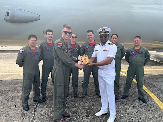 (230124-N-FY142-0002) COLOMBO, Sri Lanka (Jan. 24, 2023) – Lt. Cmdr. Harischandra of the Sri Lanka Navy presents Lt. Nick Morris of Patrol Squadron (VP) 10 and Combat Aircrew 5 with a plaque as a token of appreciation for their involvement in exercise Cooperation Afloat Readiness and Training/Marine Exercise Sri Lanka 2022. VP-10 is currently operating from Kadena Air Base in Okinawa, Japan. The squadron conducts maritime patrol and reconnaissance, as well as theater outreach operations, as part of a rotational deployment to the U.S. 7th Fleet area of operations. (U.S. Navy photo by Lt. j.g. Brian DePaola)