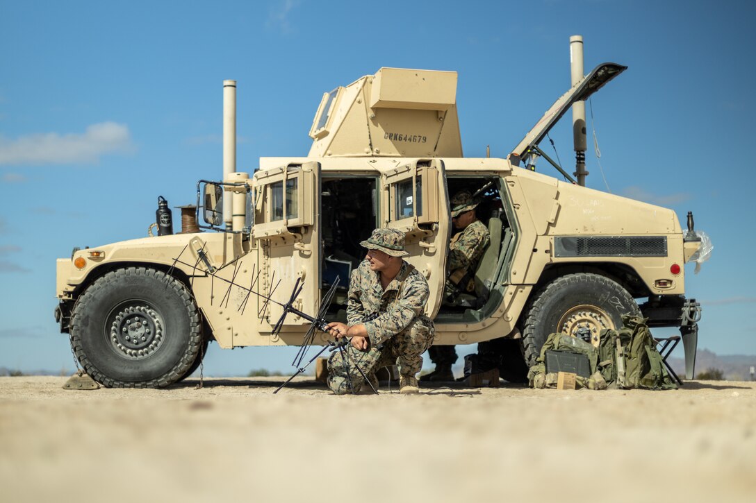 U.S. Marine Corps Cpl. Jacob Ferinde, a radio operator with 3d Littoral Anti-Air Battalion, 3d Marine Littoral Regiment, 3d Marine Division, sets up an antenna during Marine Littoral Regiment Training Exercise at Marine Corps Air station Yuma, Arizona, Jan. 28, 2023.