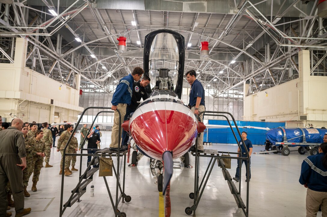 Air Force ROTC Detachment 060 cadets from the University of Southern California tour a USAF Thunderbirds aircraft at Edwards Air Force Base, California, Jan. 27. The cadets spent the day learning about the various career fields available to them upon graduation and entering into service.