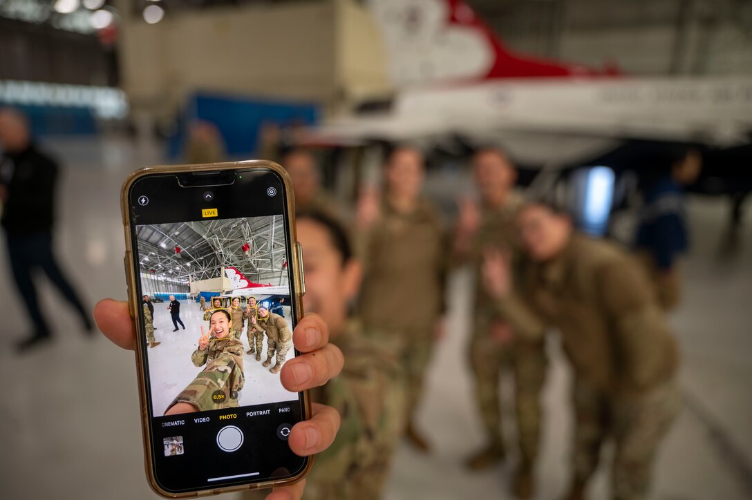 Air Force ROTC Detachment 060 cadets from the University of Southern California take a photo in front of a USAF Thunderbirds aircraft at Edwards Air Force Base, California, Jan. 27. The cadets spent the day learning about the various career fields available to them upon graduation and entering into service.