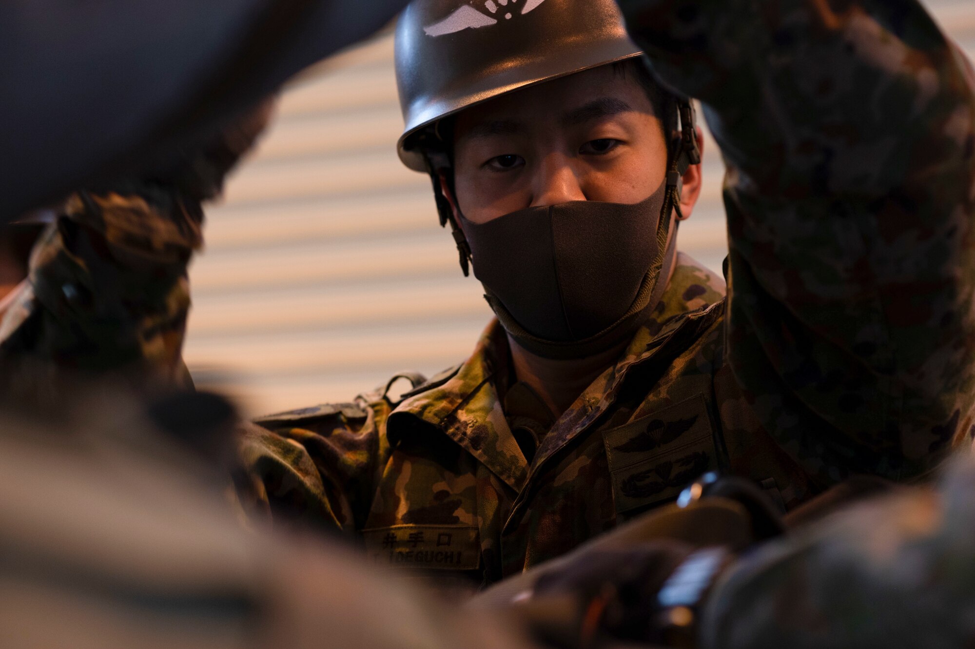 A soldier from the Japan Ground Self-Defense Force builds a Containerized delivery system bundle