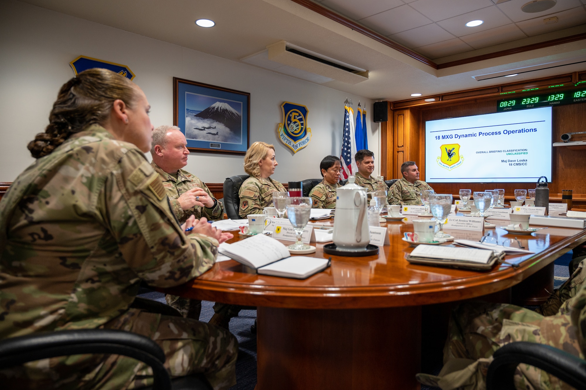 Airmen sit at conference table