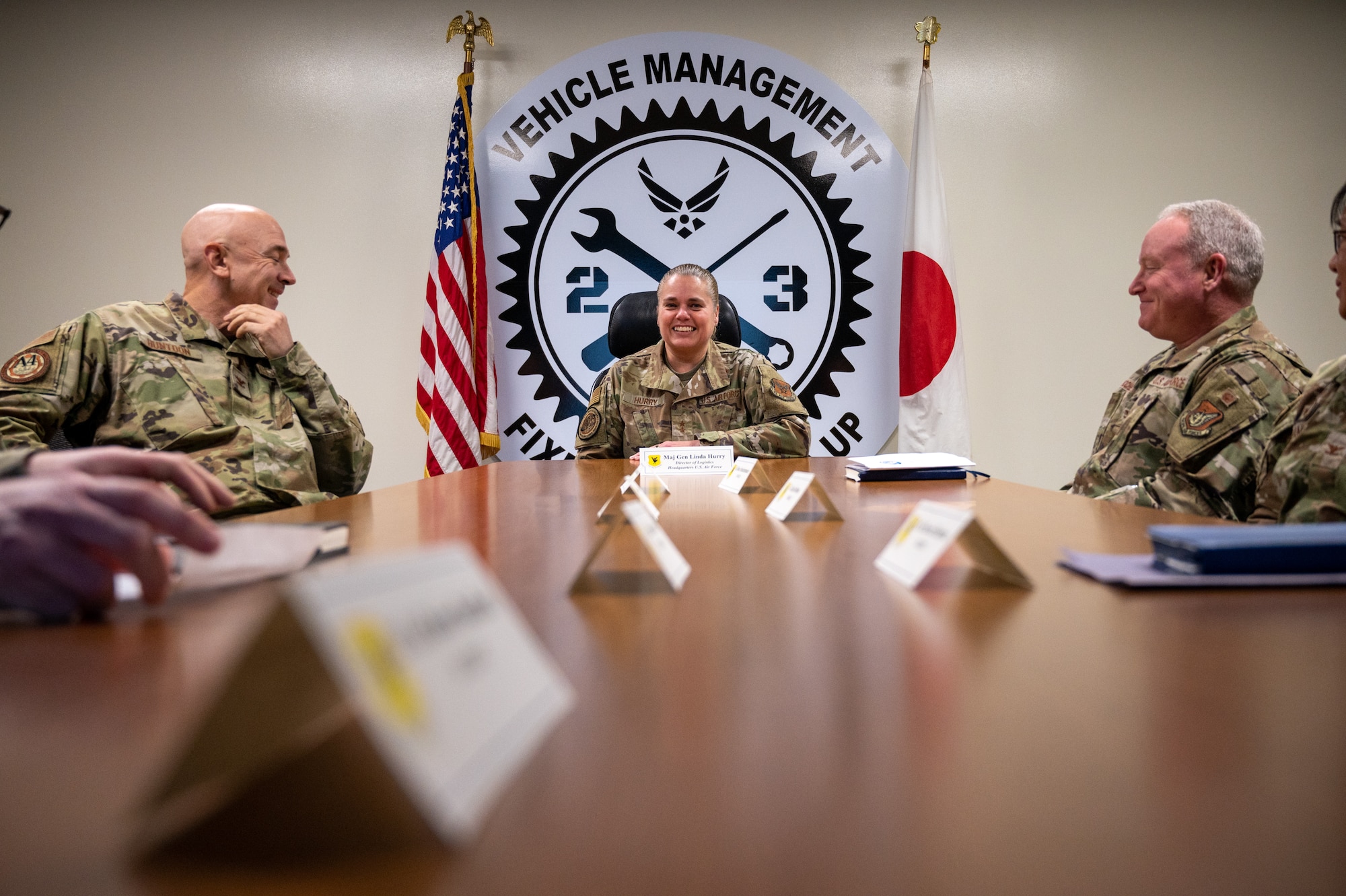 Airmen sit at conference table