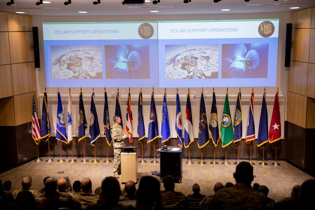 Chief Warrant Officer Sean Eversole, a Coast Guard liaison, presents the capabilities and limitations of USCG cold water ice diving to representatives of the National Guard Arctic Interest Council during their quarterly meeting at Camp Ripley Training Center, Minnesota, Jan. 25, 2023.