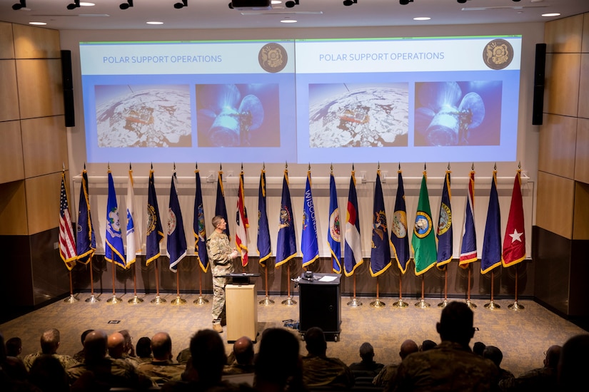 Chief Warrant Officer Sean Eversole, a Coast Guard liaison, presents the capabilities and limitations of USCG cold water ice diving to representatives of the National Guard Arctic Interest Council during their quarterly meeting at Camp Ripley Training Center, Minnesota, Jan. 25, 2023.