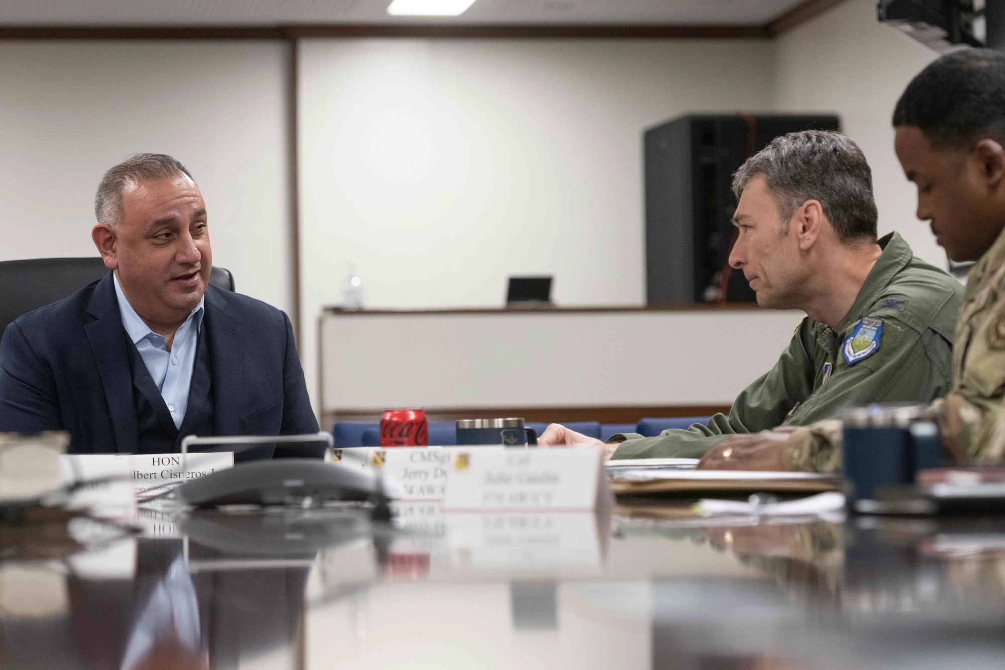 Gilbert Cisneros Jr., Under Secretary of Defense for Personnel & Readiness, left, speaks with Col. Andrew Roddan, 374th Airlift Wing commander, right, during his visit to the 374th Airlift Wing headquarters at Yokota Air Base, Japan, Jan. 30, 2023.