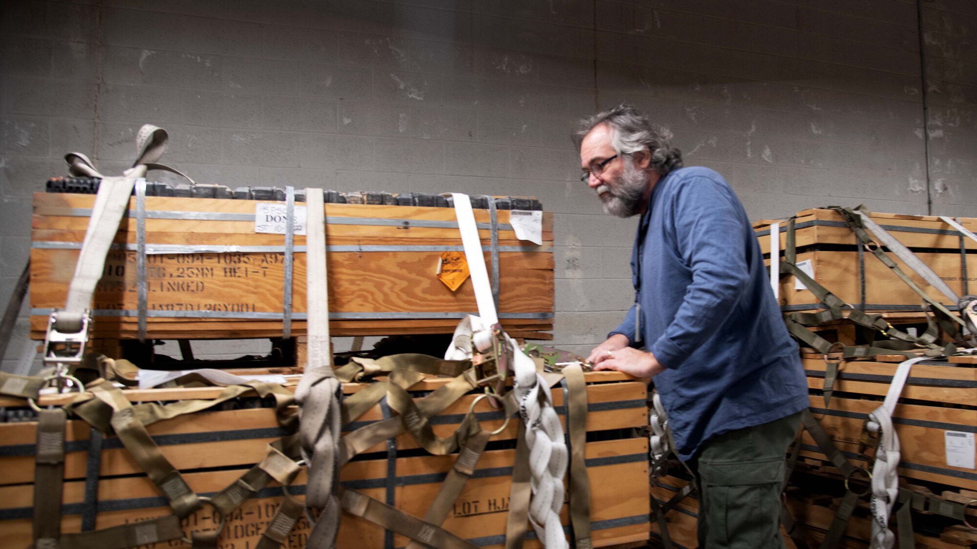 Carl Palmer inspects munitions