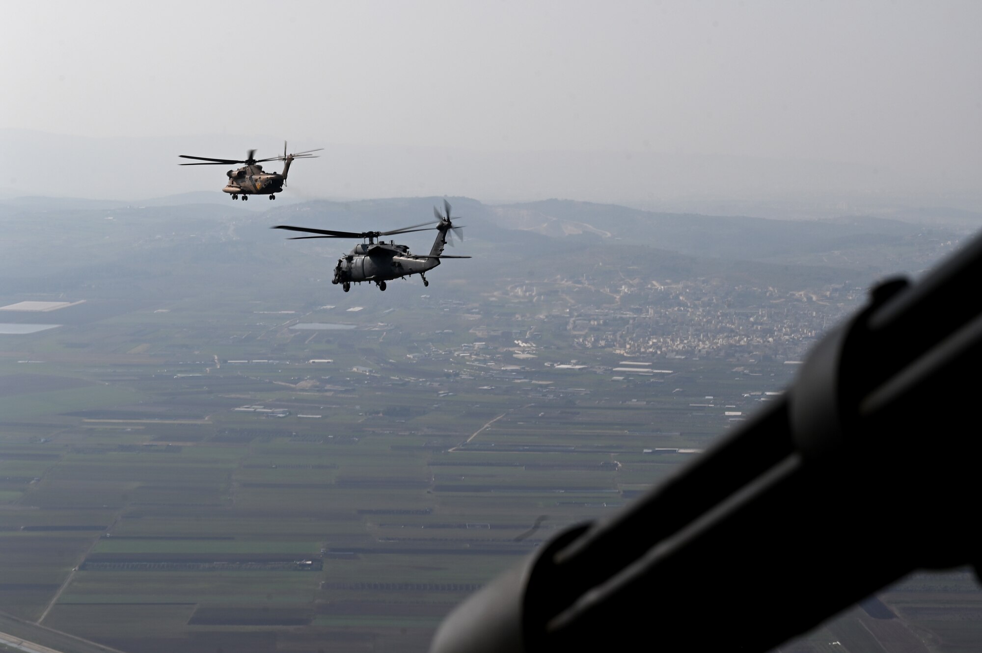 An Israeli Air Force UH-60 Black Hawk helicopter and two U.S. Air Force HH-60 Pave Hawks assigned to the 46th Expeditionary Rescue Squadron conduct a combat search and rescue exercise in Northern Israel, Jan. 24, 2023. Juniper Oak is a large-scale bilateral multi-domain exercise aimed to enhance interoperability between U.S. and Israeli armed forces contributing to integrated regional security. (U.S. Air Force photo by Staff Sgt. Gerald Willis)