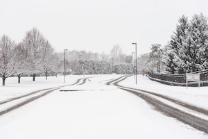 Tire tracks are outlined along a snowy road in Area A on Jan. 22 at Wright-Patterson Air Force Base, Ohio.