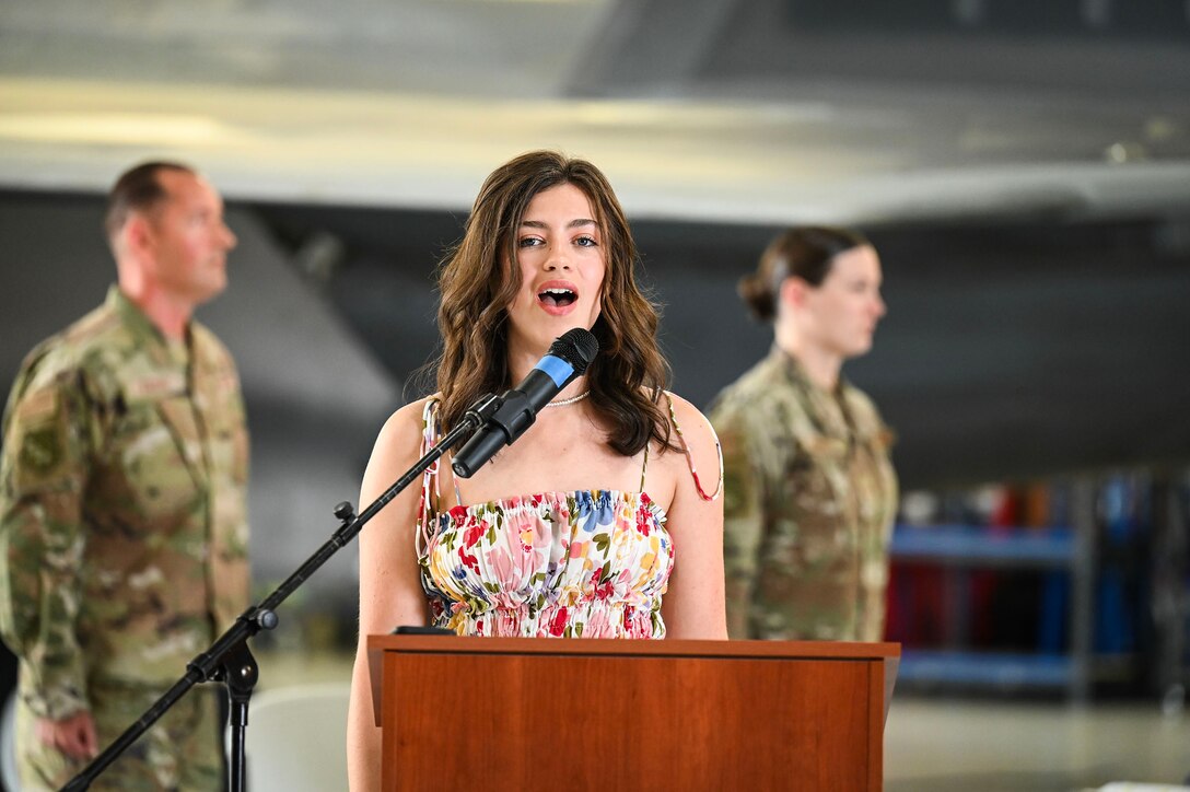 Civilian sings national anthem.