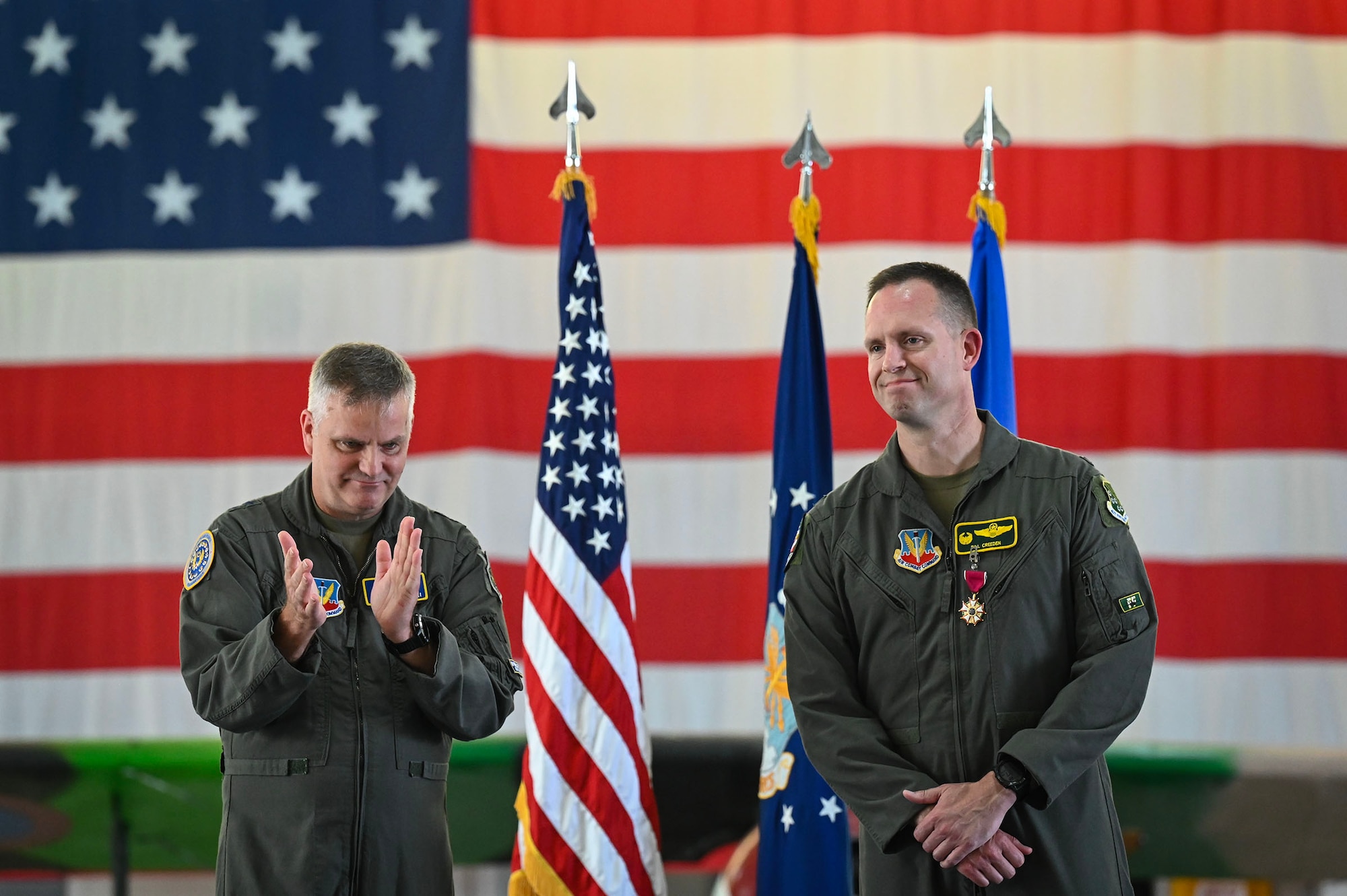 Airman claps for another Airman.
