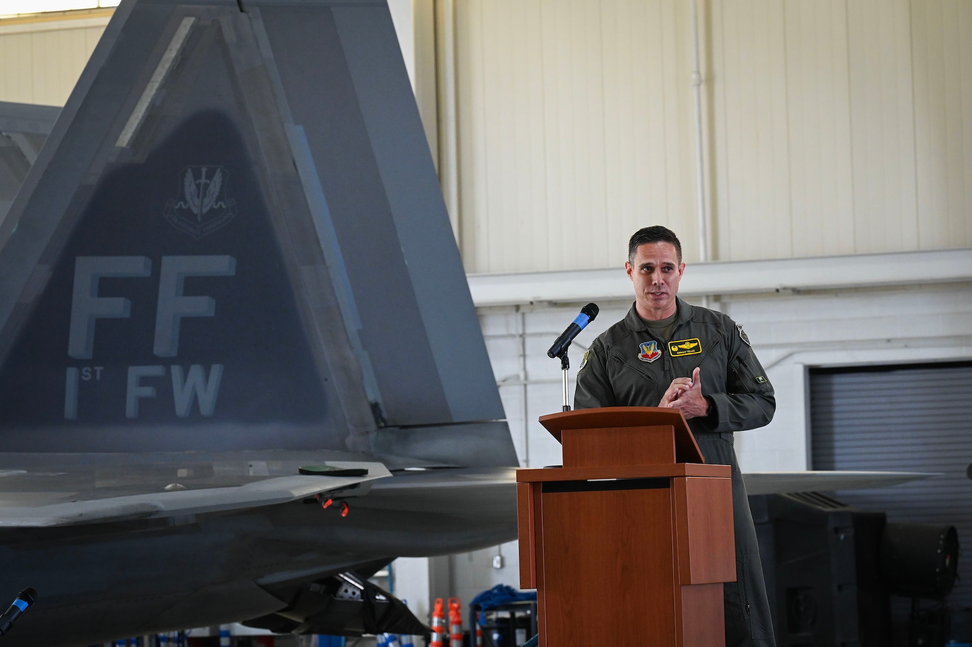 Airman talks to a crowd.
