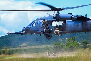 A U.S. Air Force HH-60G Pave Hawk assigned to the 56th Rescue Generation Squadron from Aviano Air Base lands to pick up survivors during exercise Jolly Vihar