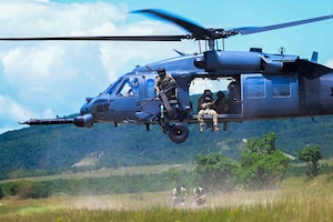 A U.S. Air Force HH-60G Pave Hawk assigned to the 56th Rescue Generation Squadron from Aviano Air Base lands to pick up survivors during exercise Jolly Vihar