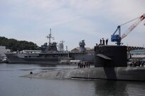 The Ohio-class guided-missile submarine USS Michigan (SSGN 727) arrives in Fleet Activities Yokosuka, July 2, 2023. Homeported in Naval Base Kitsap, Bangor, Washington, Michigan provides strike and special operation mission capabilities from a stealthy, clandestine platform.