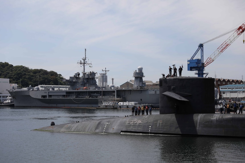 The Ohio-class guided-missile submarine USS Michigan (SSGN 727) arrives in Fleet Activities Yokosuka, July 2, 2023. Homeported in Naval Base Kitsap, Bangor, Washington, Michigan provides strike and special operation mission capabilities from a stealthy, clandestine platform.