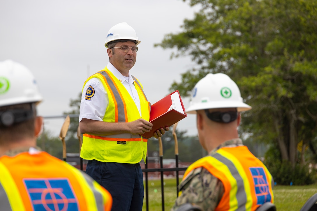 Representatives from the Office in Charge of Construction (OICC) Florence, Whiting-Turner Contracting Company attend the groundbreaking ceremony for Military Construction Project 142, the construction of a replacement fire station and satellite station, at Marine Corps Air Station Cherry Point, May 31, 2023.