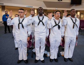 Recruits become naturalized citizens during a naturalization ceremony at Recruit Training Command.