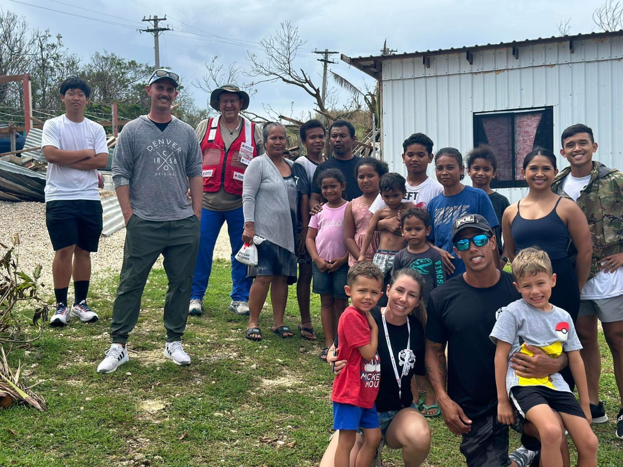 U.S. Air Force Tech. Sgt. Mark Eastman, second from left, 51st Logistics Readiness Squadron fuels distribution NCOIC, poses for a photo with other Typhoon Mawar recovery volunteers and locals near Andersen Air Force Base, Guam. Eastman and his team assisted the Red Cross in delivering aid to remote villages by visiting 1,300 families and distributing over 103,000 pounds of aid. (Courtesy photo)