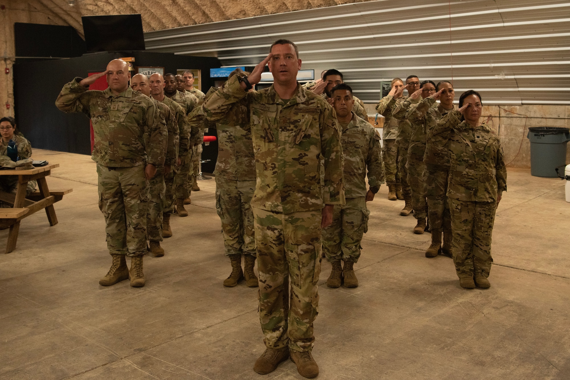 Airmen from the 36th TAS salute their new commander.
