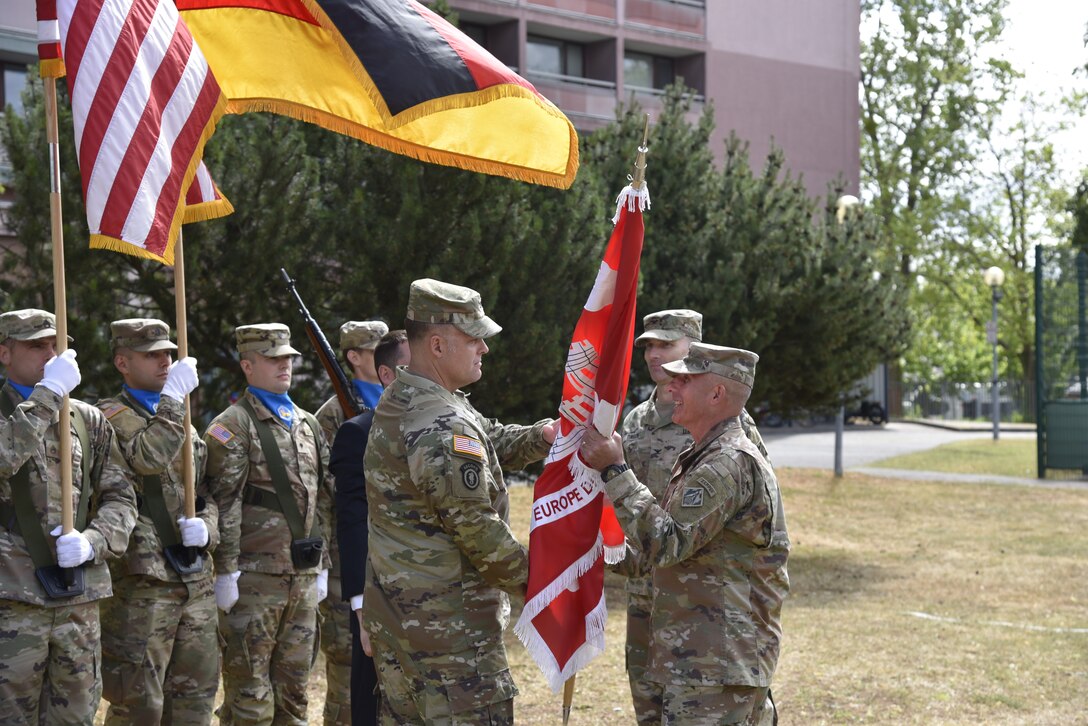 Incoming U.S. Army Corps of Engineers, Europe District Commander Col. Daniel R. Kent accepts the regimental flag from U.S. Army Corps of Engineers, North Atlantic Division Commander Col. John Lloyd during a military change of command ceremony at the Amelia Earhart Center July 5, 2023. He assumed leadership from Col. Patrick J Dagon, who had commanded Europe District since June 2020. Kent takes command of one of the largest and most globally diverse Districts in the U.S. Army Corps of Engineers. (U.S. Army photo by Chris Gardner)