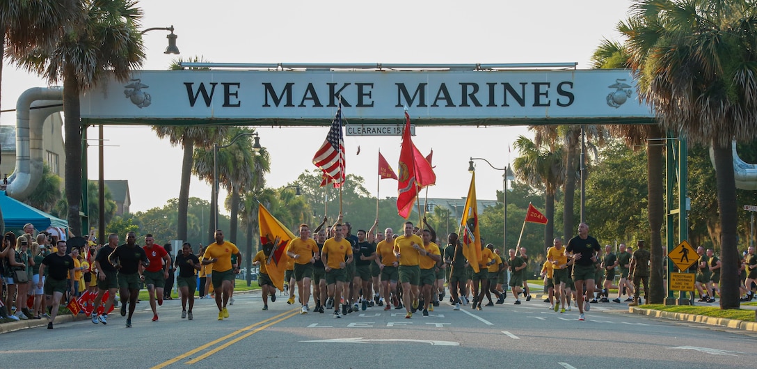 New Marines with Fox Company, 2nd Recruit Training Battalion, participate in their motivational run on Marine Corps Recruit Depot Parris Island, S.C., June 29, 2023. The new Marines run a 4-mile course passing their families who are patiently waiting to begin Family Day with their new Marines.  (U.S. Marine Corps photo by Lance Cpl. Sarah Grawcock)