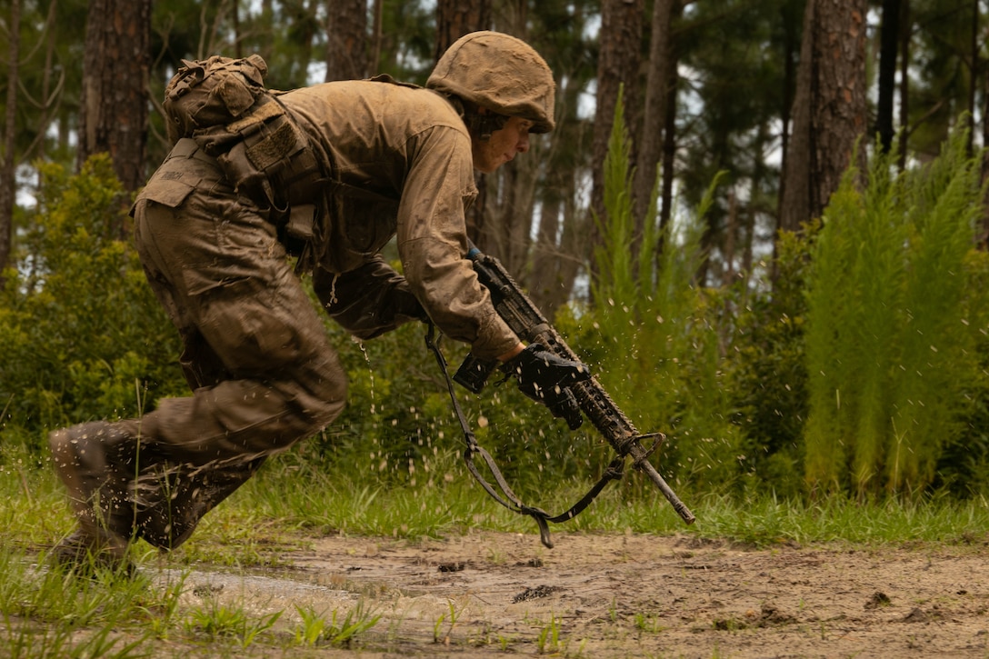 Recruits with Kilo Company, 3rd Recruit Training Battalion, maneuver the day movement course at Marine Corps Recruit Depot Parris Island, S.C., June 22, 2023. During this portion of recruit training, recruits are taught how to buddy rush, properly clear obstacles, and post security while working as a fireteam. (U.S. Marine Corps photo by Pfc. Casey Cooper)