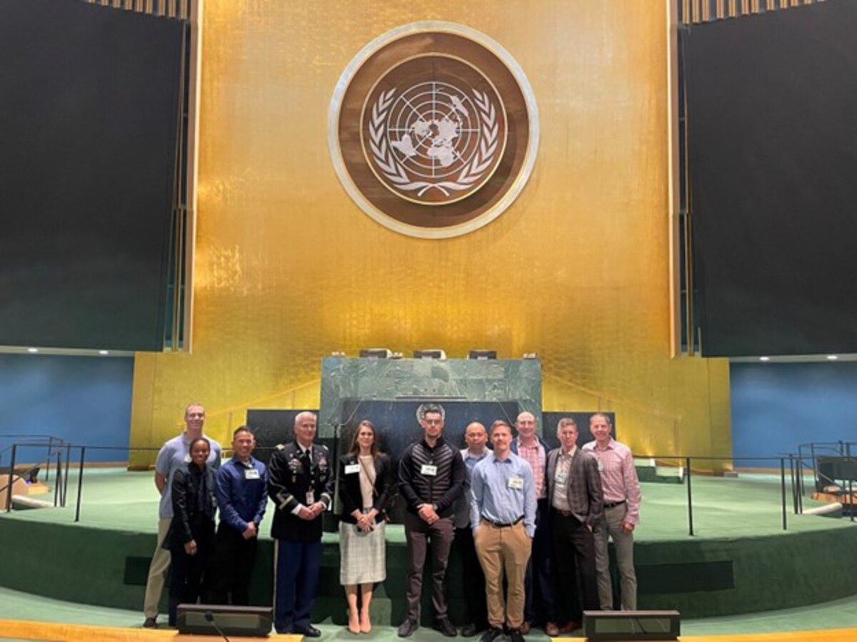 Photo of a group of people posing for a photo.